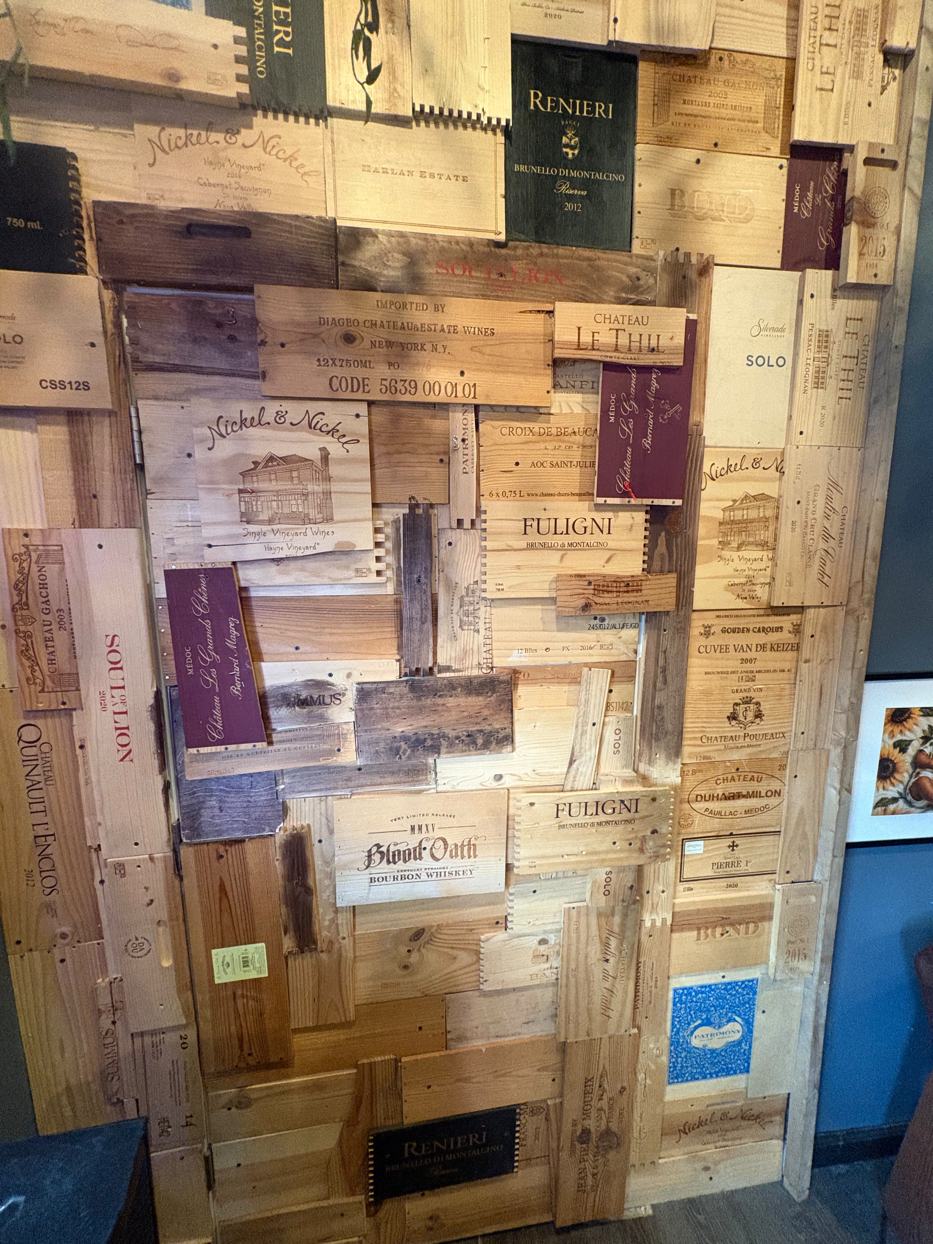 The wine-crate wall that hides the entrance to Intertwine's upstairs speakeasy
